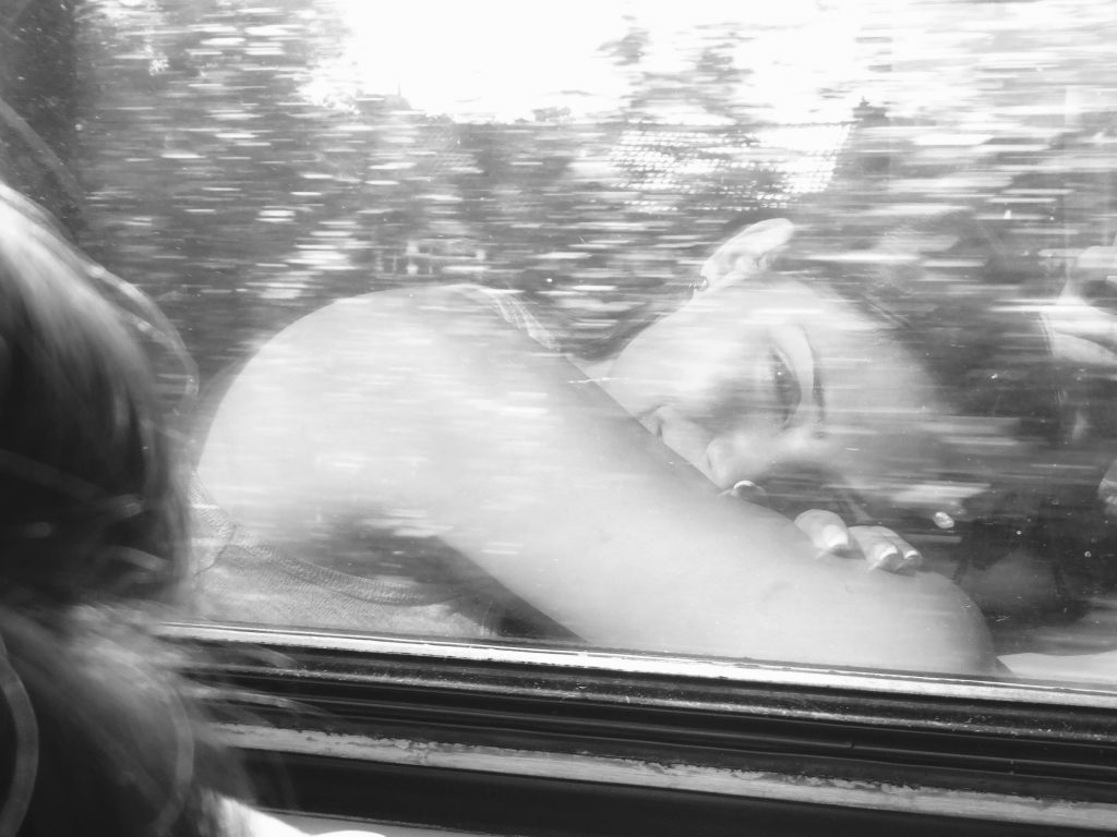girl reflection in train window