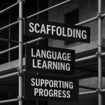 Black and white photograph of scaffolding structure symbolizing layered language learning, progress, and fluency development.